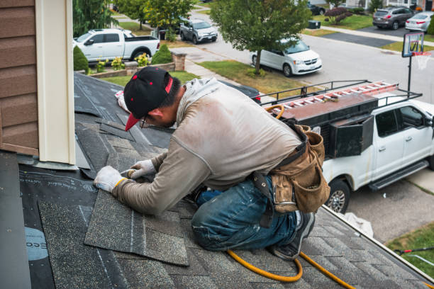 Professional Hail Damage Roof Repair technician working in Baldwin City, KS